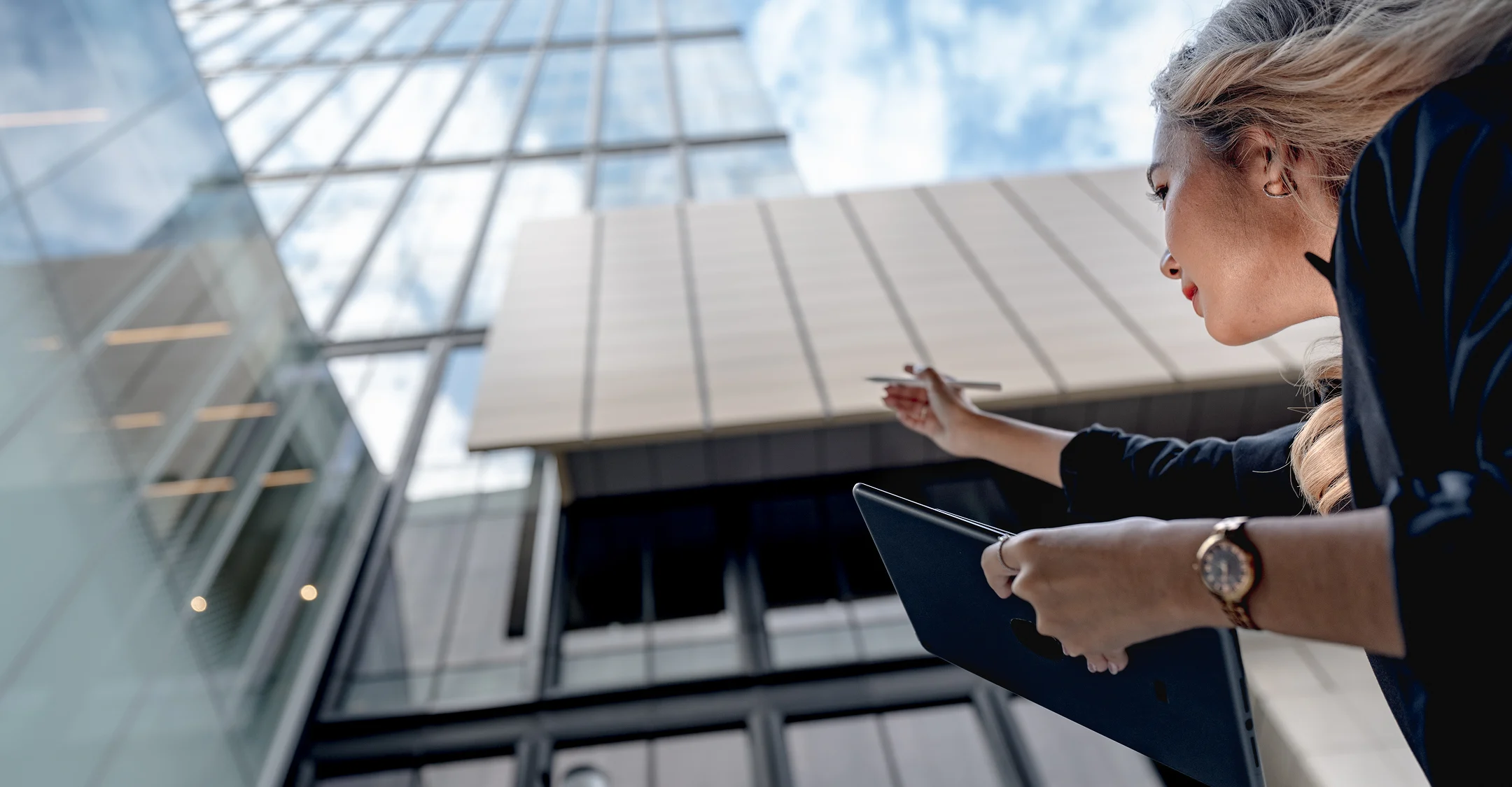 Engineer reviewing a building facade with a tablet